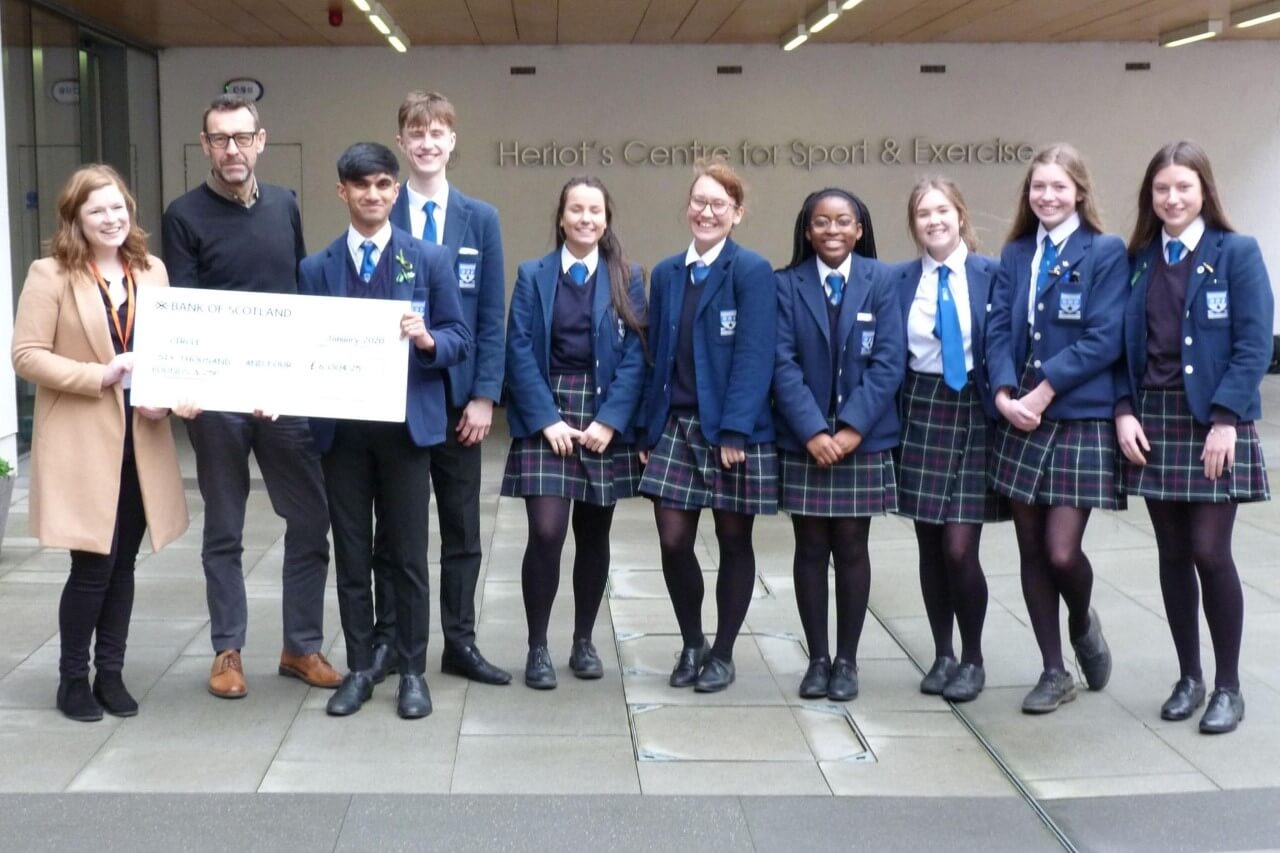 S6 presenting cheque to Circle Scotland charity
